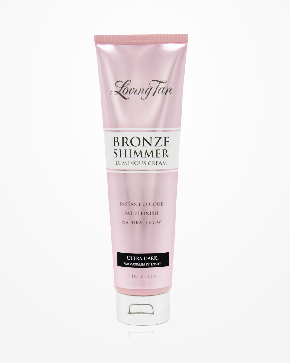 Loving Tan's Bronze Shimmer Luminous Cream in "Ultra Dark" comes in a pink 120 ml (4 fl oz) tube and offers an immediate glow with a satin finish and natural radiance, providing the perfect luminous touch for a sun-kissed look.