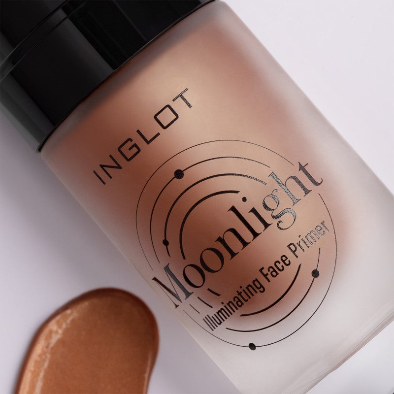 A bottle of Inglot's Moonlight Illuminating Face Primer with a black cap is displayed, perfect for prepping your skin for makeup. The slightly angled bottle showcases the label's abstract circular patterns, and a hint of bronzy swatch on the side suggests the natural radiance it provides.