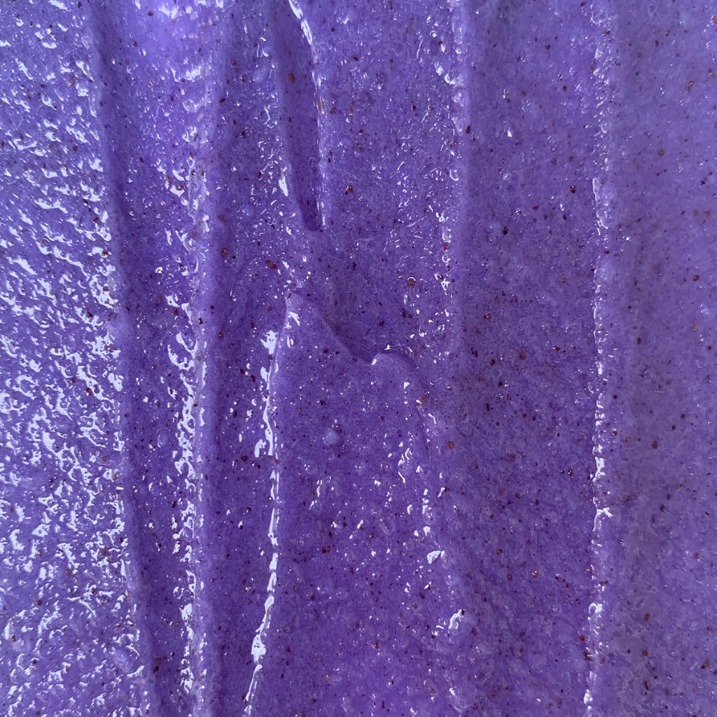 A close-up of a vibrant purple solution, the Super Acai Exfoliator by Eco Tan transforms your skin into the ultimate defender for your complexion.