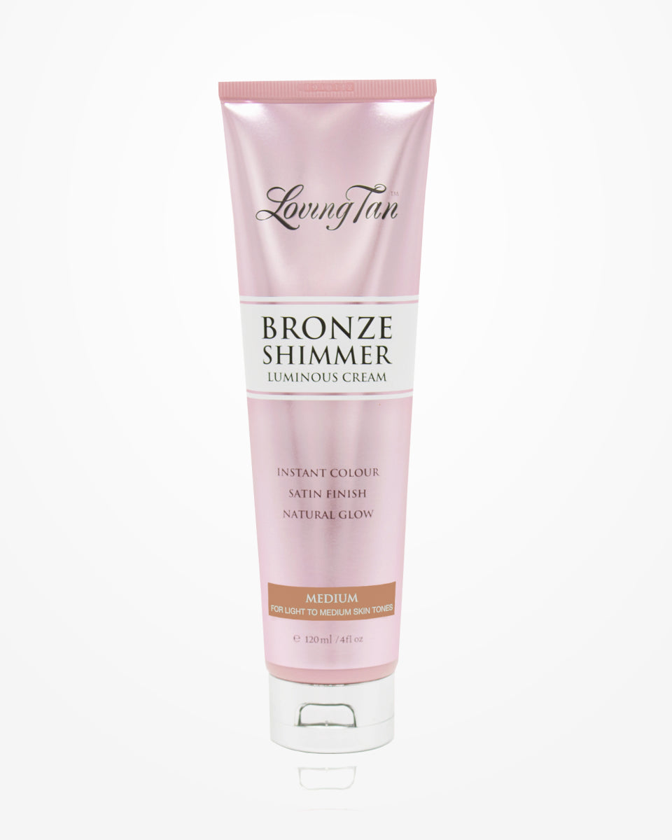 The "Bronze Shimmer Luminous Cream" by Loving Tan is a pink tube designed for medium skin tones. It offers an instant color with a satin finish to enhance your natural glow, containing 120ml or 4 fl oz of radiance-boosting product.