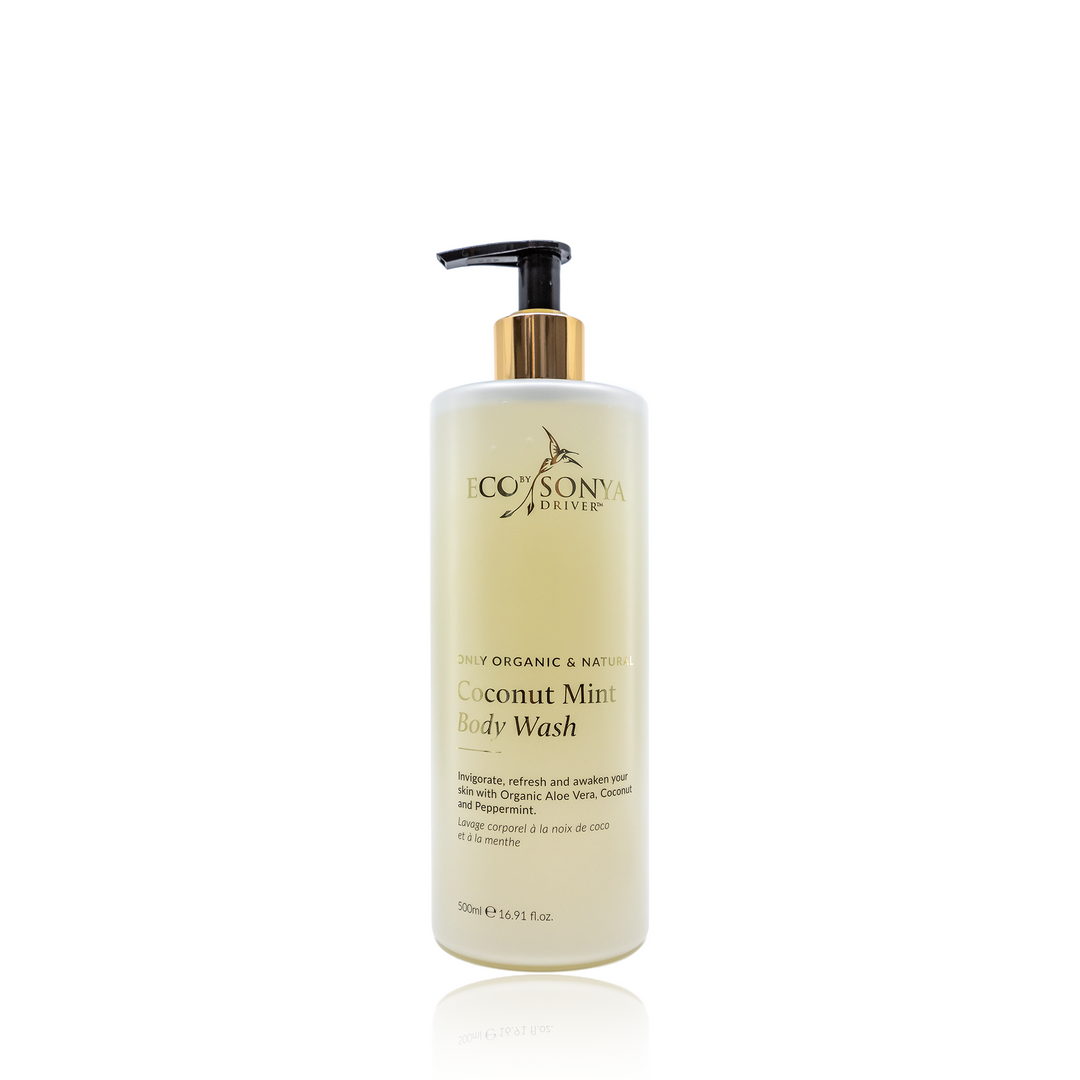 A 500 ml (16.9 fl oz) bottle of Eco Tan Coconut Mint Body Wash, featuring a pump dispenser, prominently displays its organic coconut and aloe vera ingredients on the label. It is infused with peppermint for a refreshing cleanse.