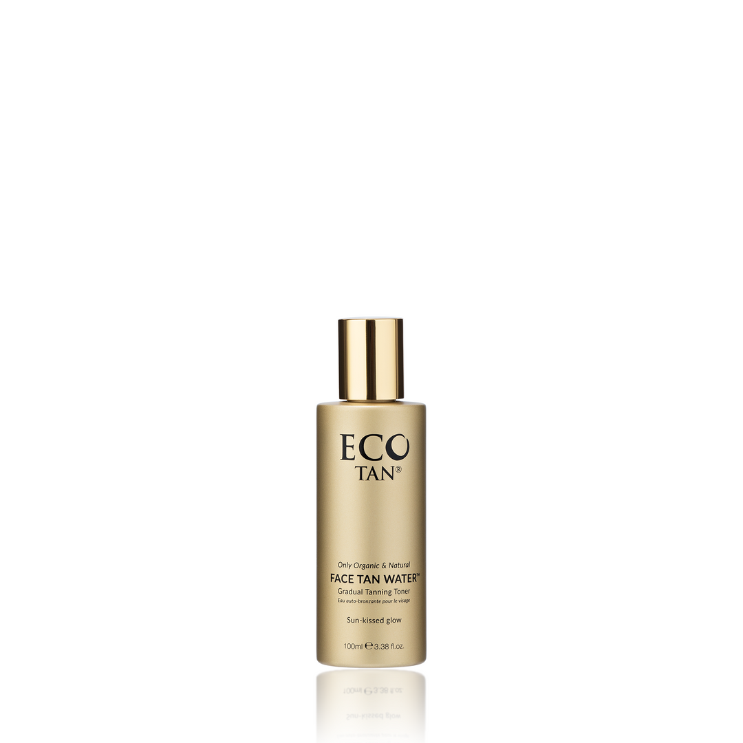 A gold cylindrical bottle of Face Tan Water by Eco Tan features a metallic cap and a label that reads "Natural Organic Face Tan Water & Gradual Tanning Toner," offering a healthy golden glow. Set against a white background, this skincare essential elevates your routine to an elite level.