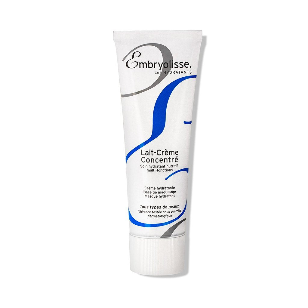 A tube of Embryolisse Lait-Crème Concentré features a white design with blue and grey accents. It's an iconic French product, renowned as a versatile moisturizer cherished by families and perfect for all skin types.